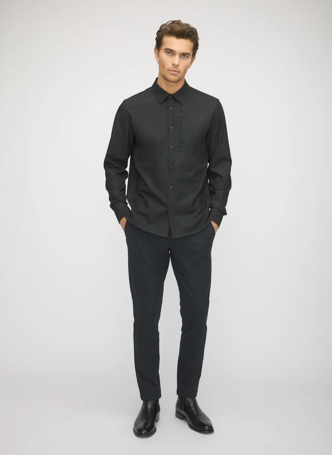 Sharp finished black button-up shirt ready for shipment